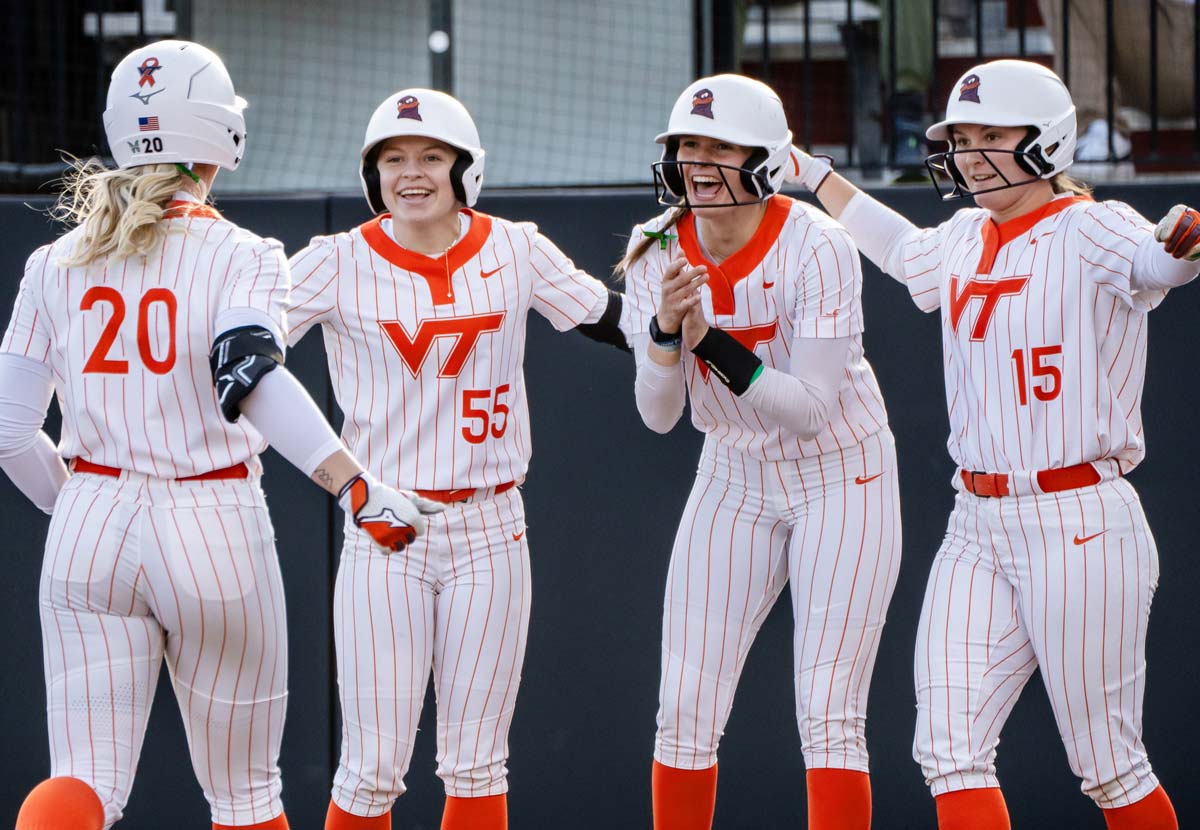 softball players celebrating